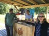 Kathy and Mark,  the owner of Shoal Bay Lodge drinking beer at the outdoor bar