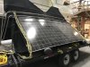 Bimini with the solar panels getting ready to be lifted in place