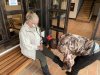 Kathy getting her gaiters put on by the staff