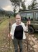 Kathy holding our walking sticks the morning of the 2nd gorilla trek