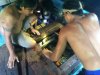 The guys fixing a busted belt