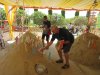 Placing incense and flowers in sand hills