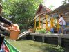 Getting bread to feed the fish at a temple