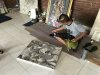 A local artist at the Coop