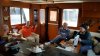 That's Glen and Sue on sv Dione and Justin celebrating with wine and pizza on Mystic