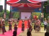 A parade of dancers passing our tent during the Exhibition
