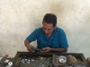 A crafstman resizing Kathy's ring