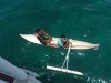 Local boys in their canoe at Saur