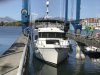 The haul out lane is 19'...we are 17' wide....not much clearance...thanks to excellent line handlers and thrusters we had no scrapes:)))