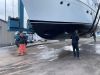The guys giving Mystic's bottom an easy power wash