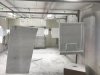 Some of the doors being painted in the paint shed