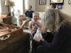Kennedy checking out what Grammie brought her from all our travels