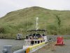 Mystic tied up to the wall in Sweepers Cove.....the boat in front did not fair too well!!
