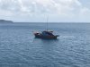 At Penjending anchorage this boat traded a bag of squid for some sodas and cookies!!!