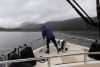 The next day.....cloudy and rainy....Kathy lifting the anchor!!