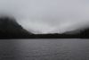 There are gorgeous snow capped mountains behind all those clouds
