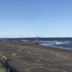 Black sand beach and Kamchatka mountains